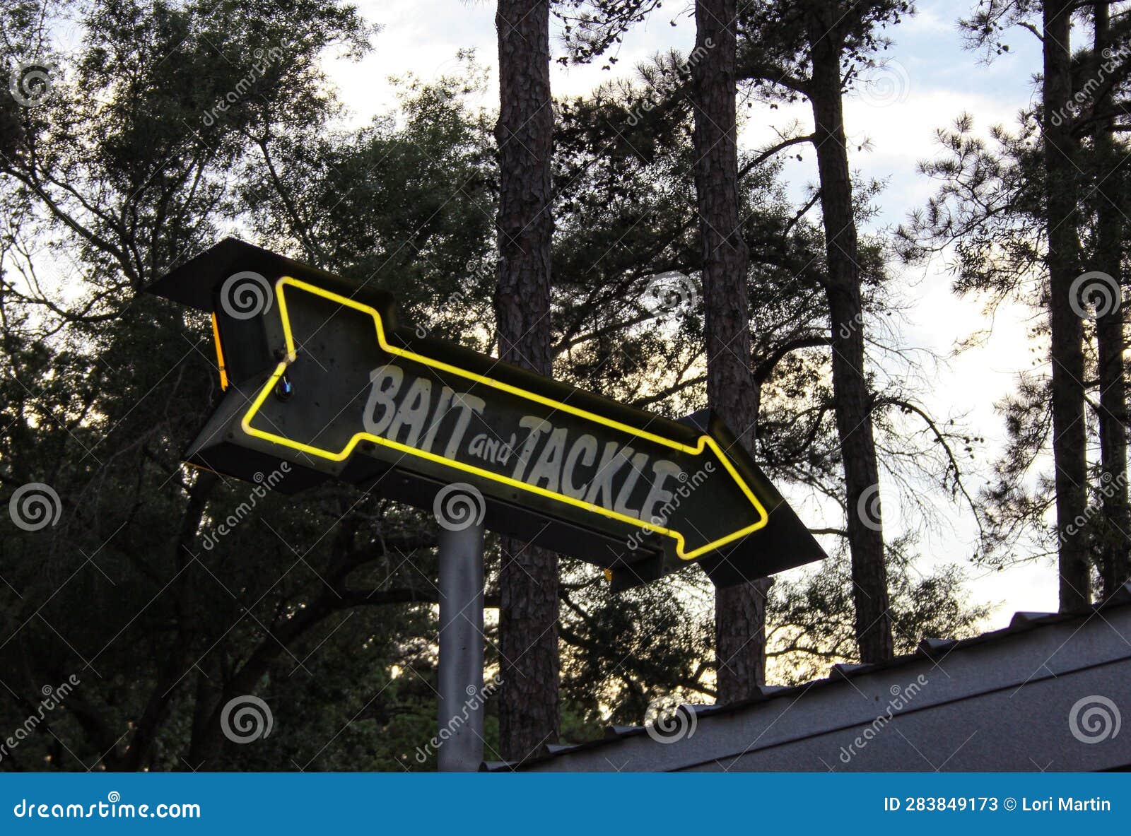 Vintage Neon Bait and Tackle Sign in Rural Area Near Lake Stock