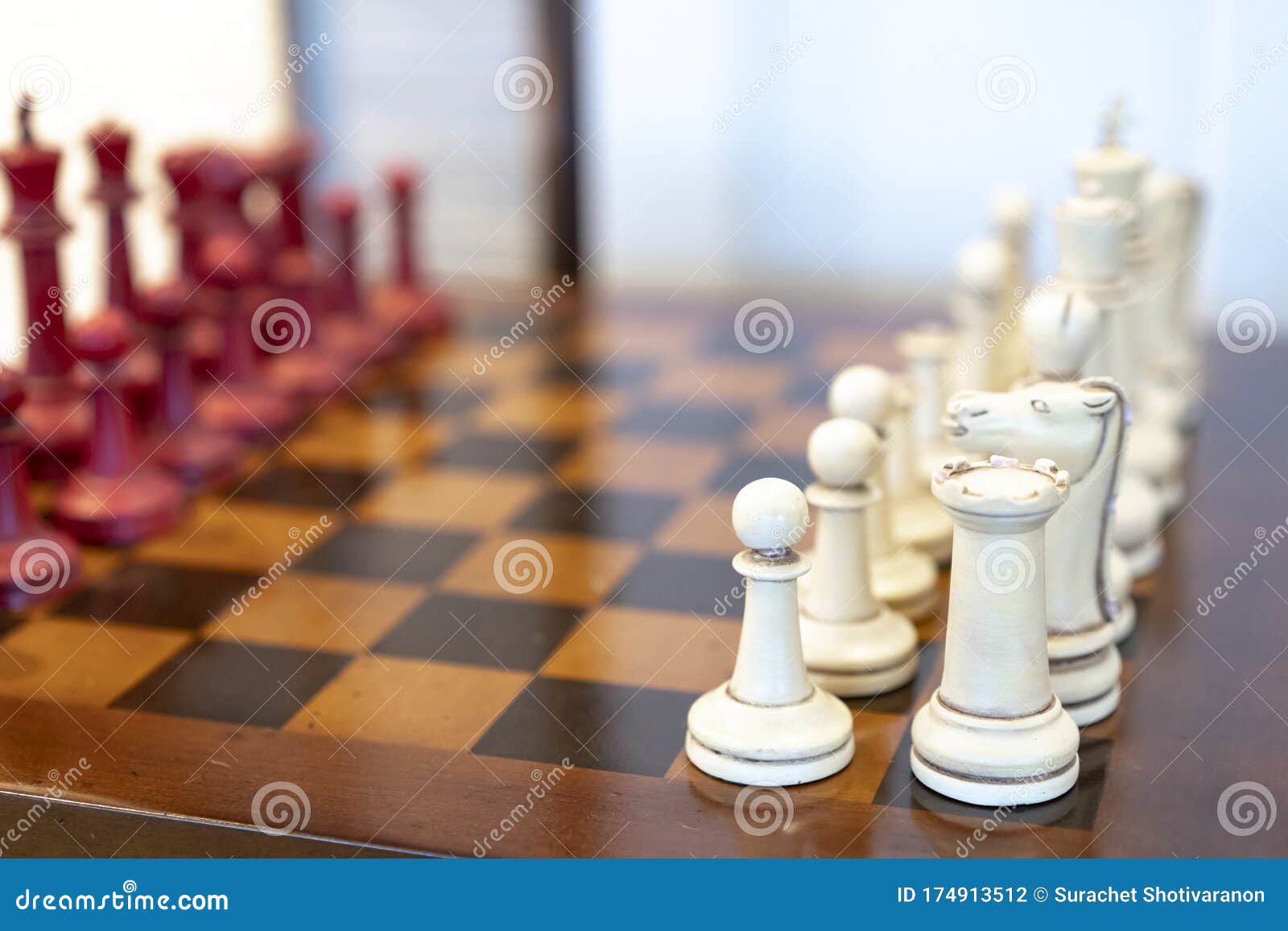 Vintage Old Chess Red and White on the Wood Board Table Stock Photo
