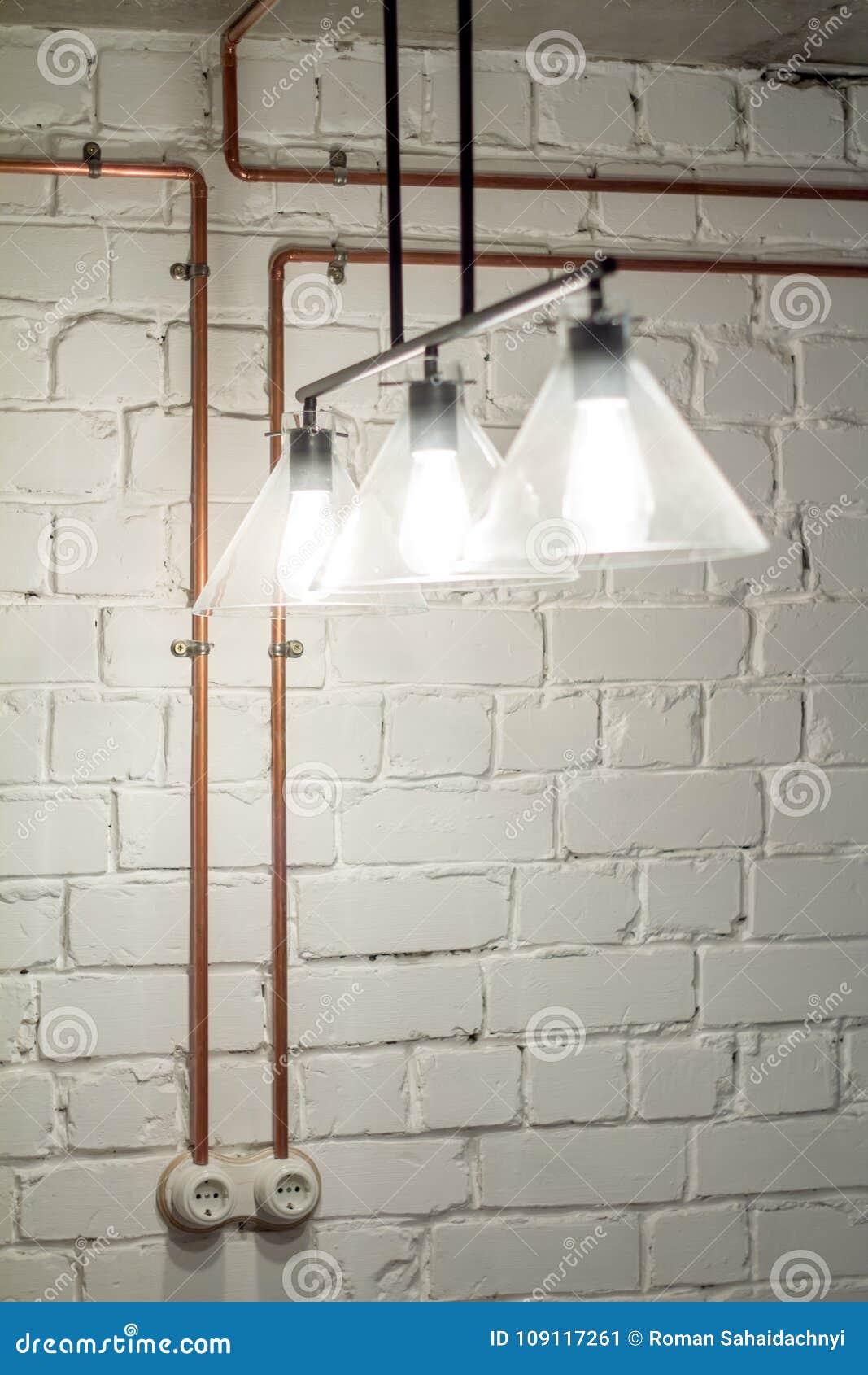 A Vintage Outlet And Electrical Wiring In A Copper Tube Stock Image