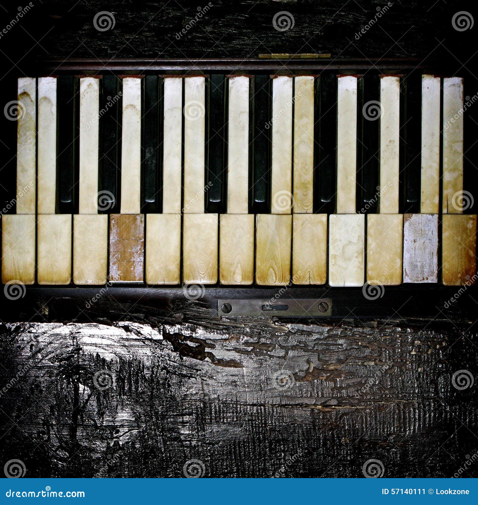 a vintage piano keyboard with charred wood accent.