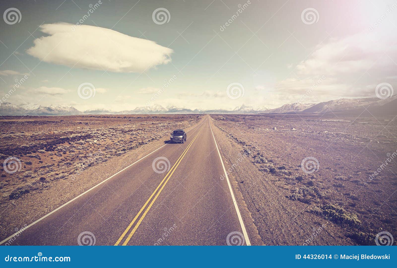 vintage picture of car on endless country highway, ruta 40.