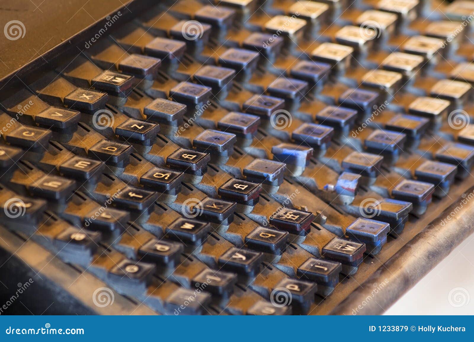 vintage printing press keyboard covered in dust and grit