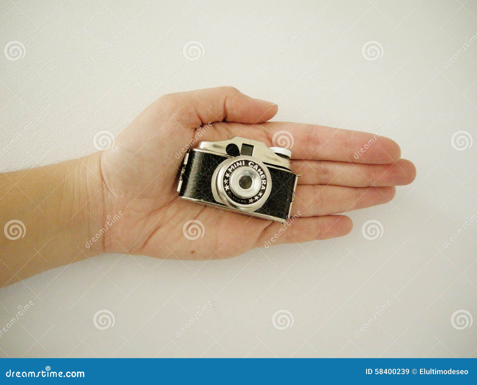 vintage small camera in the hands of a woman