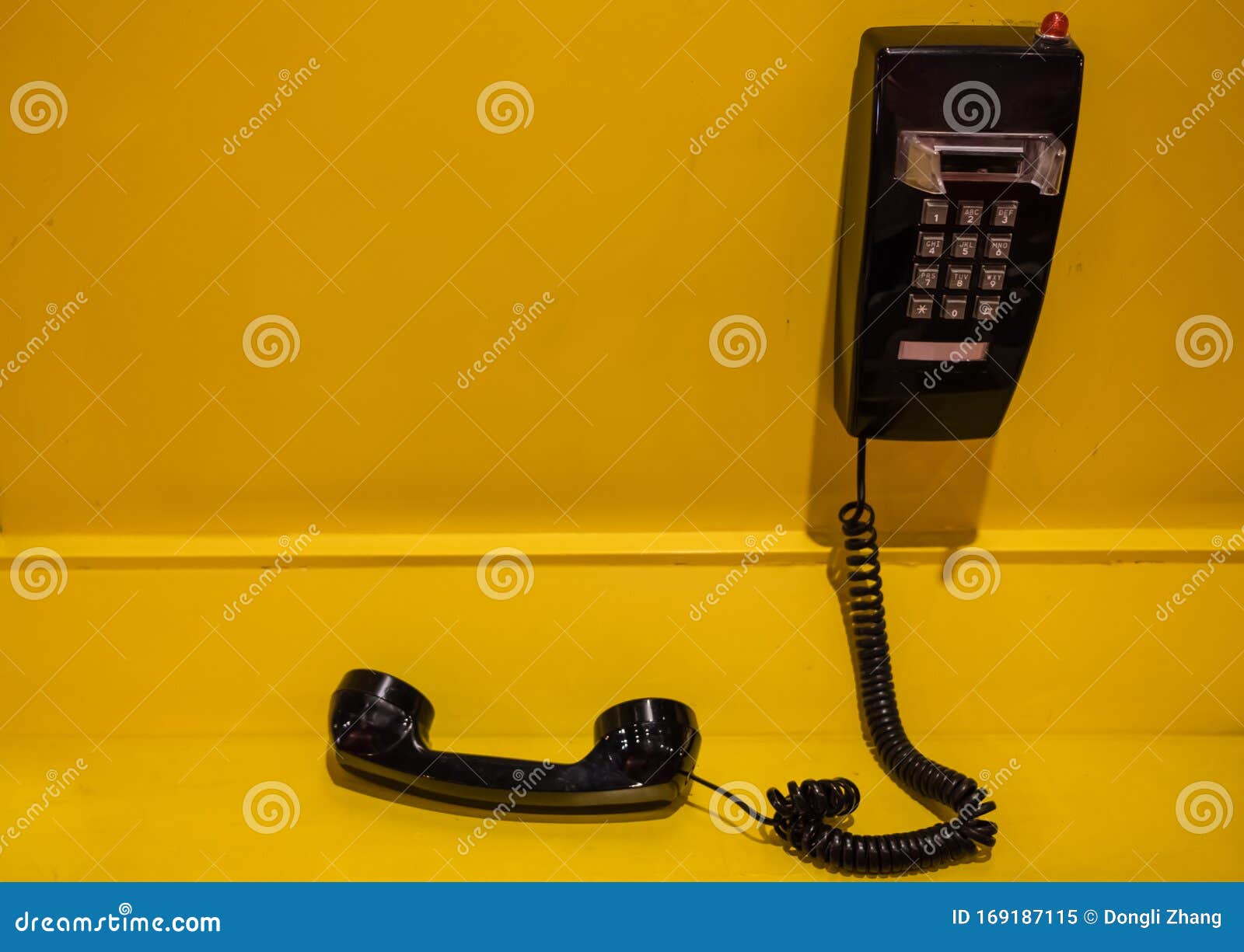 Vintage Style Black Phone Display on Yellow Wall Stock Image Image of