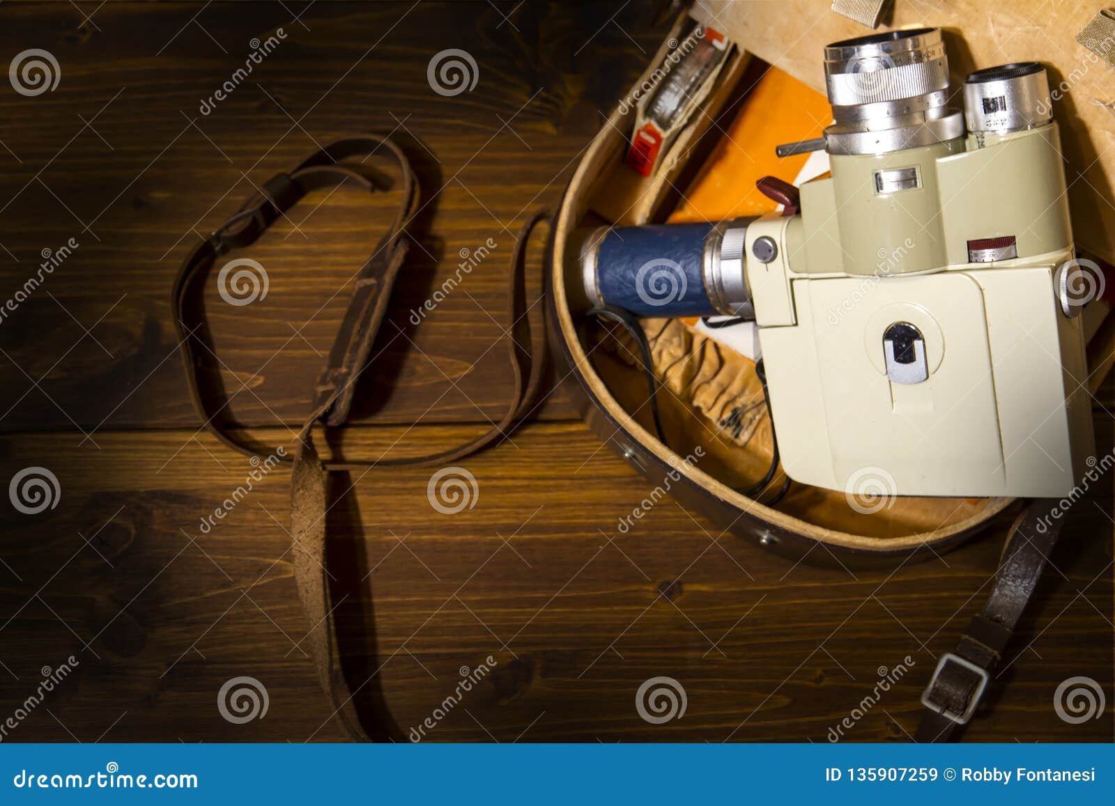 vintage super 8 cine camera from the 1960 minolta zoom 8 with his original case on wooden background