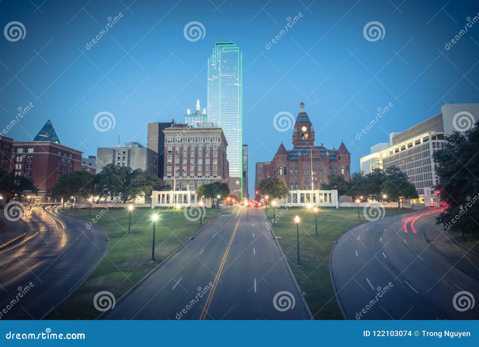 vintage skyline and light trail traffic over dealey plaza in dallas, texas