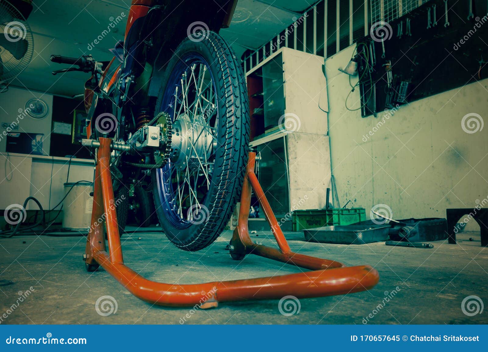 Vintage Tone of Motorcycle on a Stand in a Garage Stock Image Image of light, parking 170657645