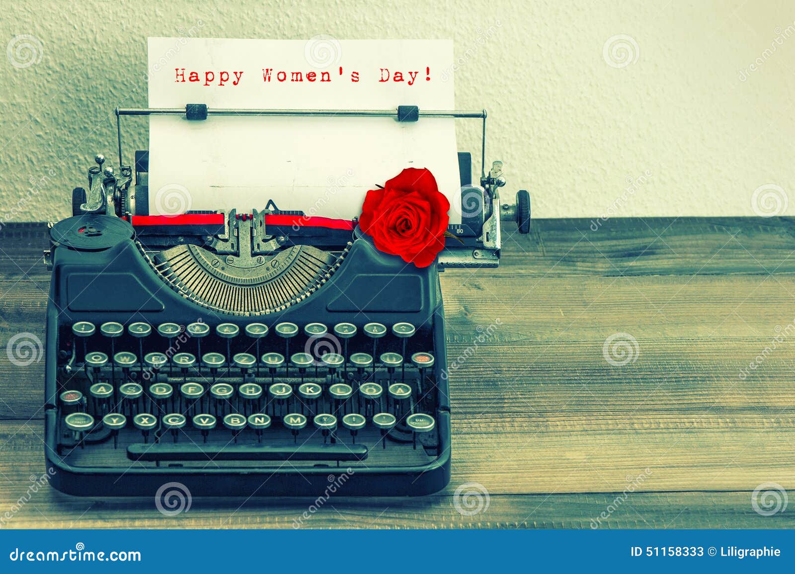 vintage typewriter with red rose flower. happy womens day