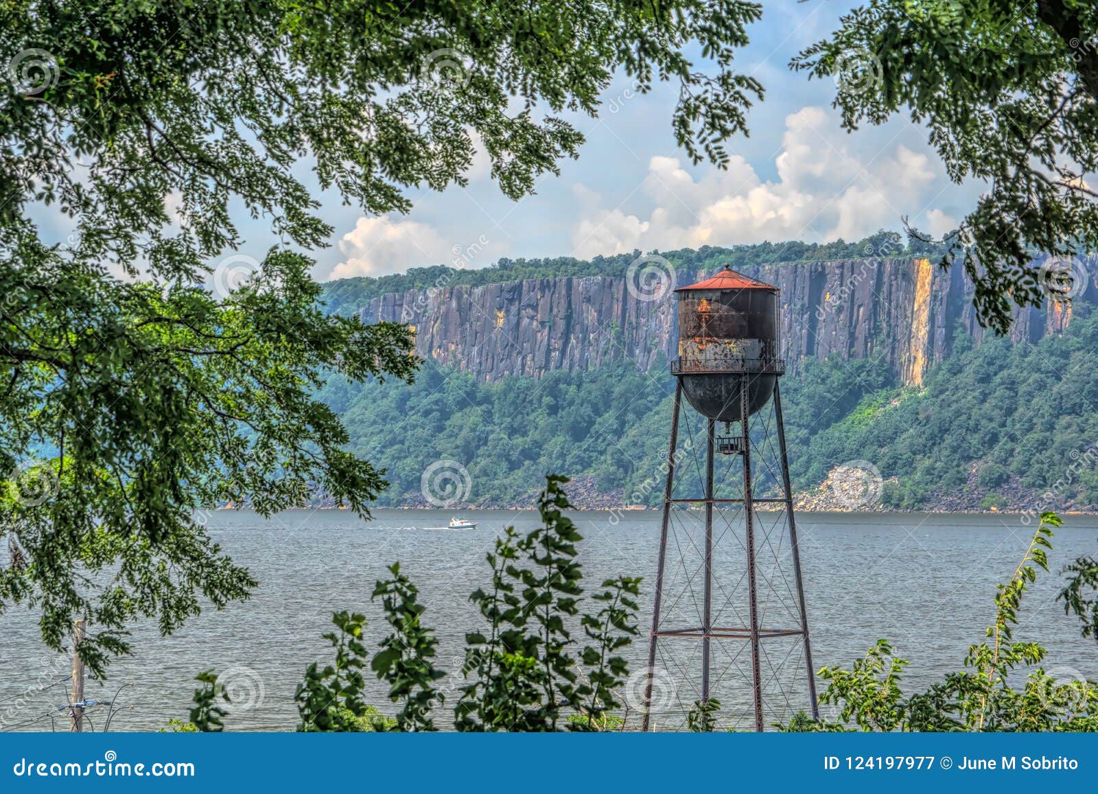 vintage water tower on the hudson river