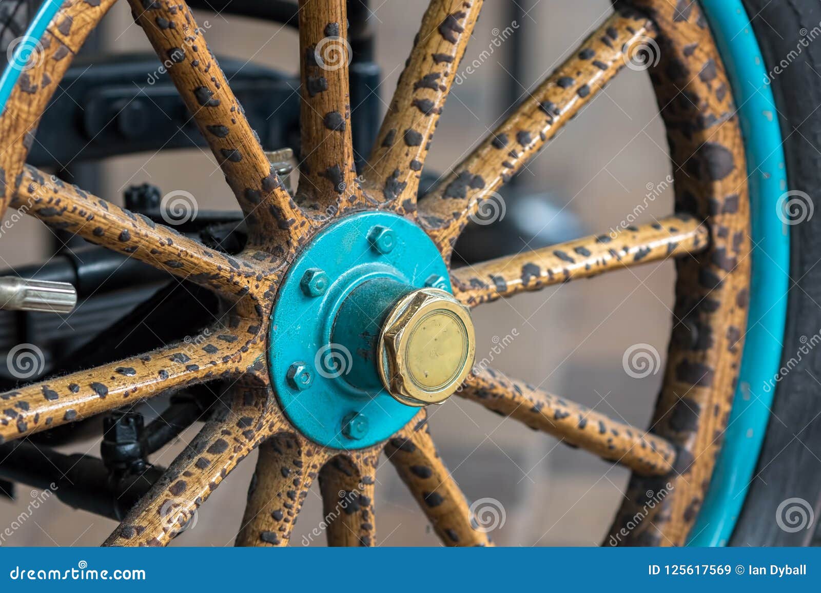 vintage wooden spoke car wheel. close-up of wood spokes