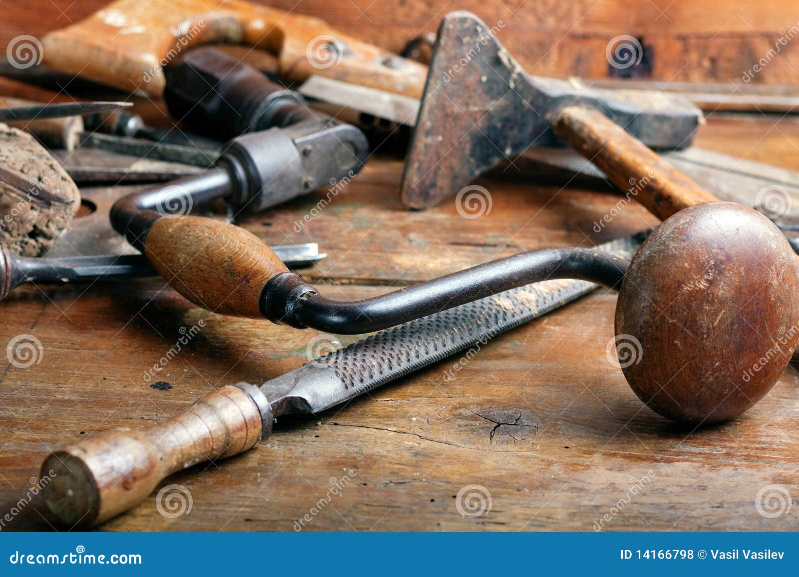 Vintage woodworking tools on wooden background.