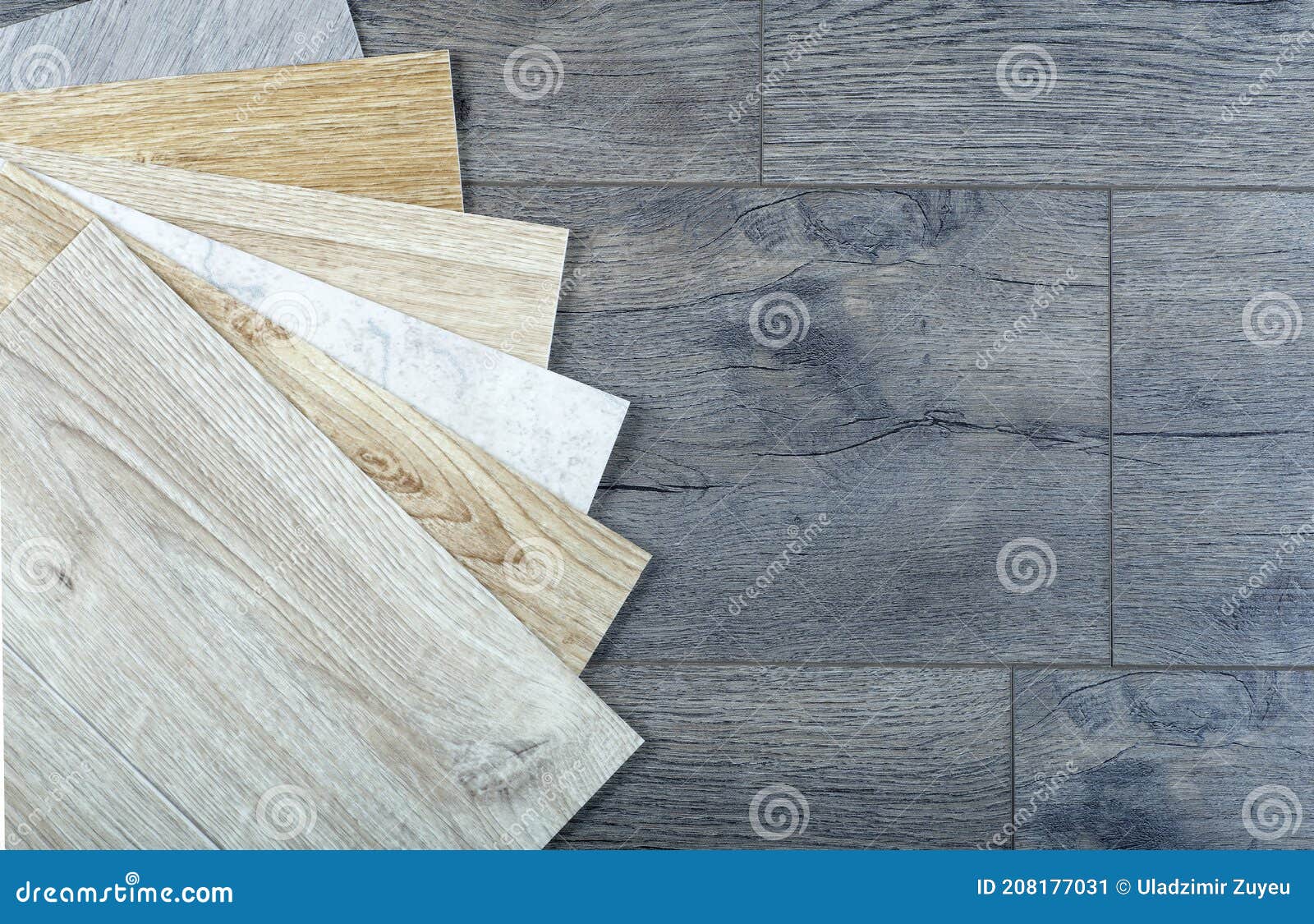 Vinyl and Linoleum Samples on a Wooden Background. Vinyl for Flooring