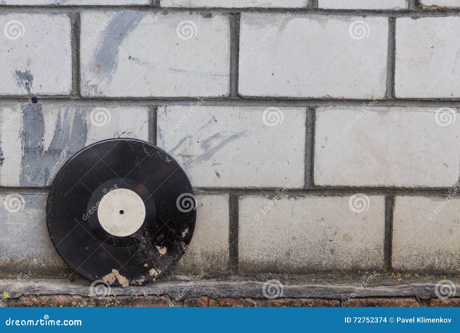 Vinyl Record on a Background of a Retro Brick Wall Stock Photo Image