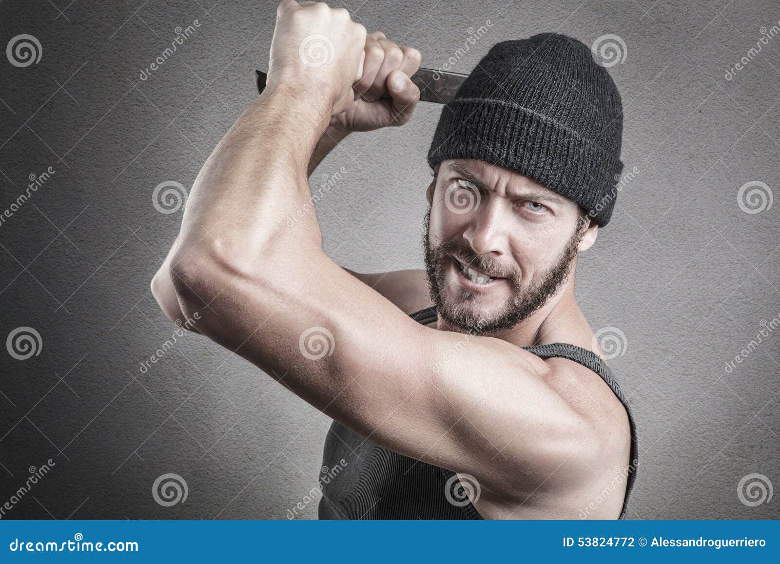 violent man using a spanner or wrench as a weapon