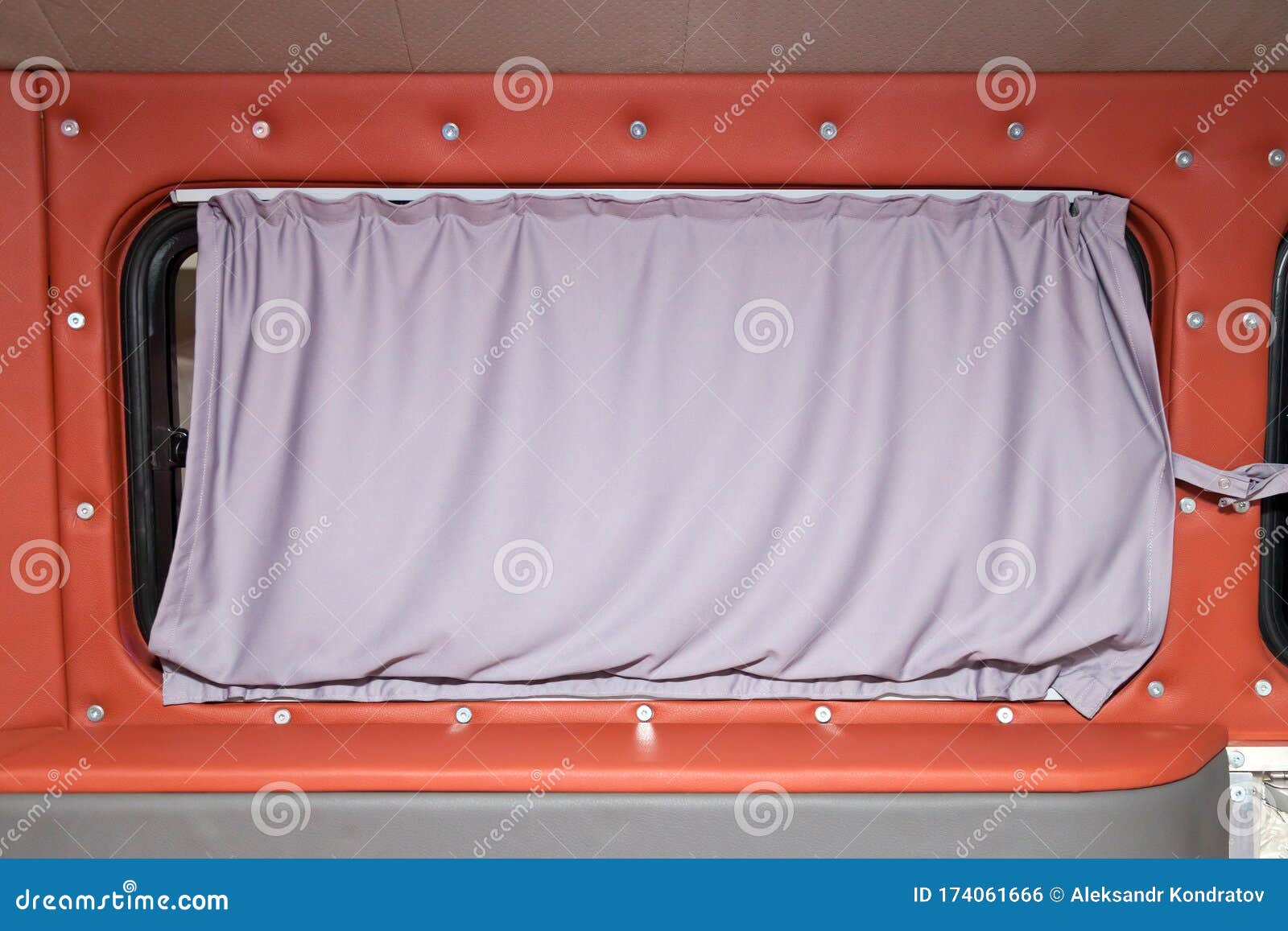 Textile Curtain on the Passenger Car Window of the Van Stock Photo