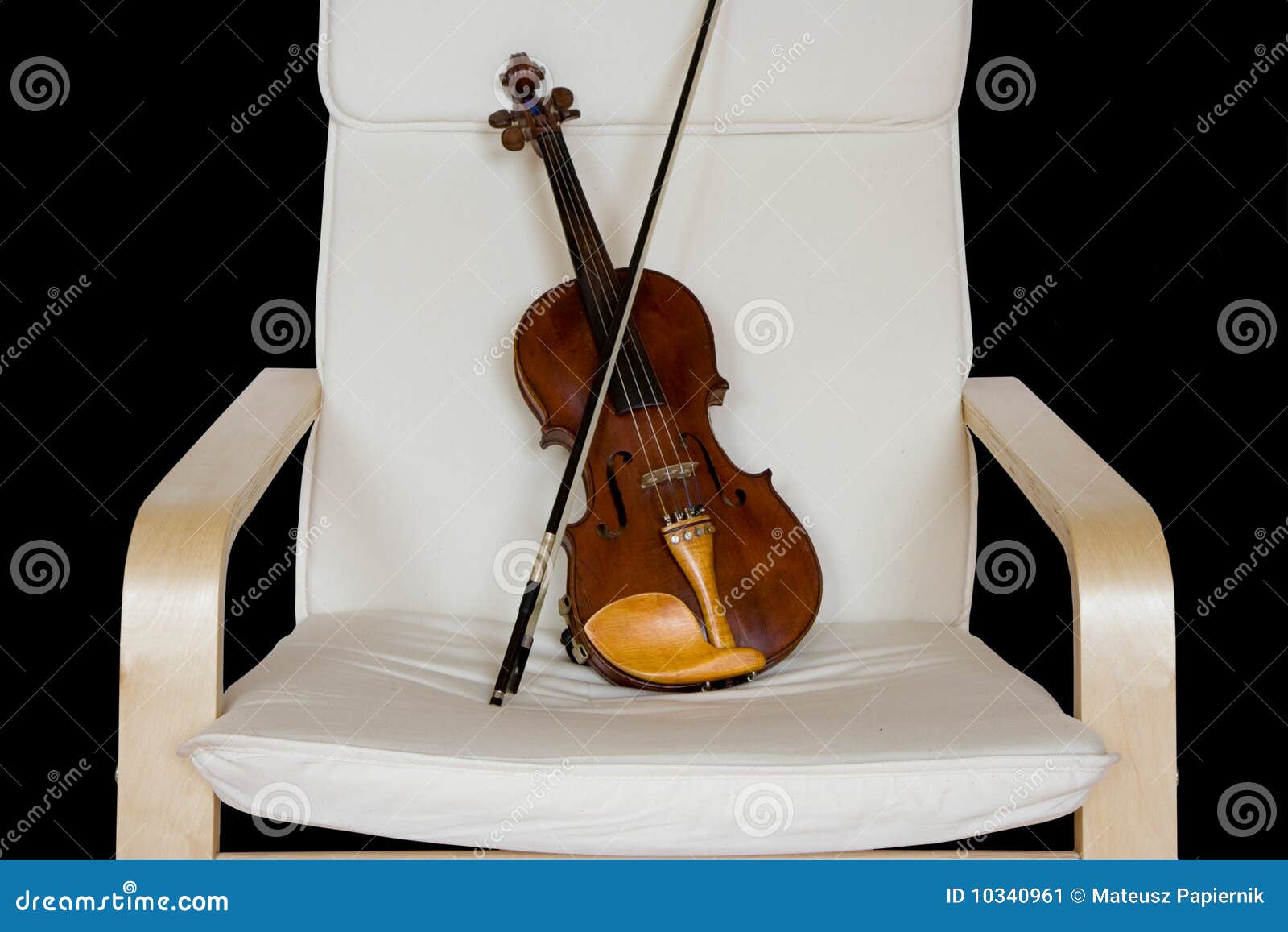Violin resting on a chair stock image. Image of closeup 10340961