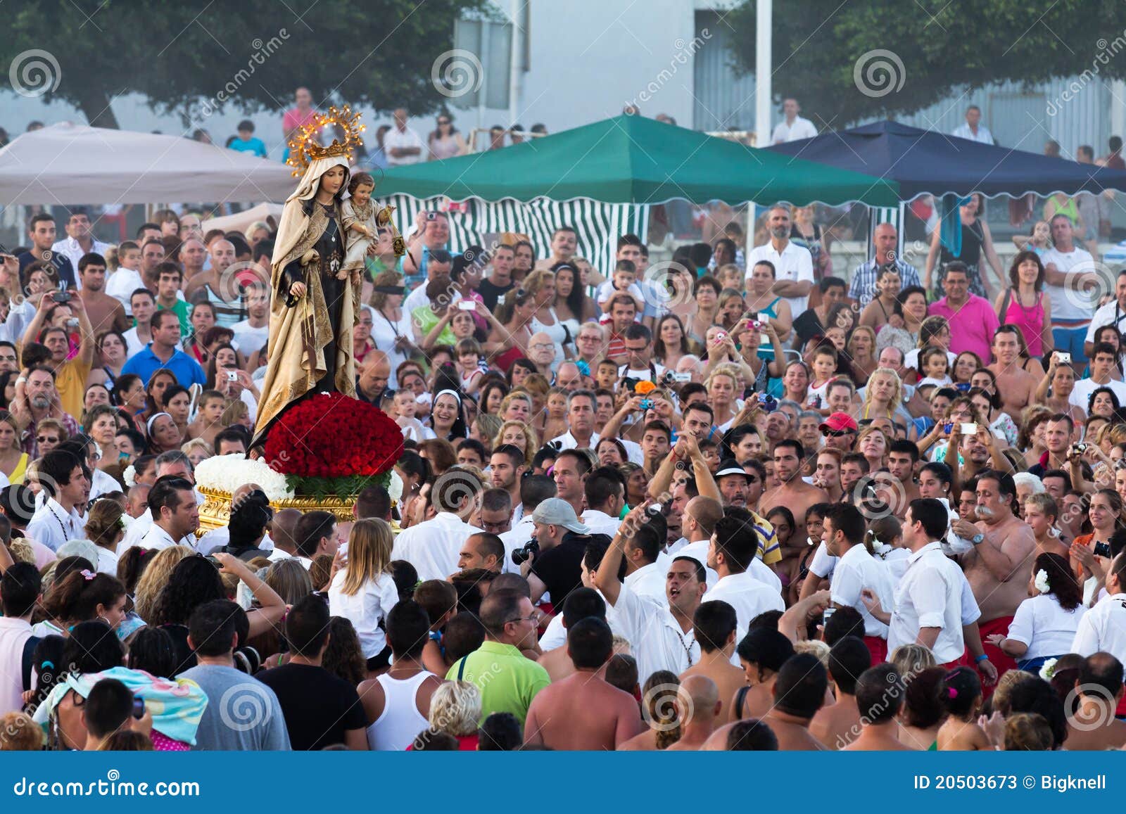 MALAGA, SPAIN - JULY 16: Unidentified local worshippers lift a religious image at the beach during the Virgen del Carmen festival on July 16, 2011 in Malaga, Spain. The Virgen del Carmen is the patron saint and protector of fishermen and sailors