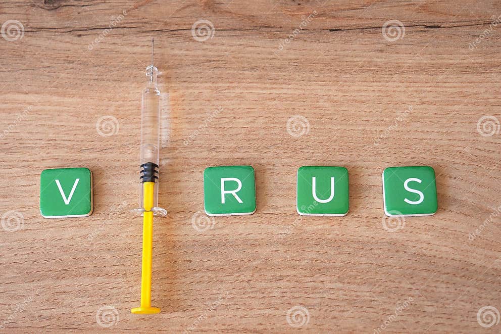Virus Word with Syringe. Infectious Diseases Concept Stock Photo