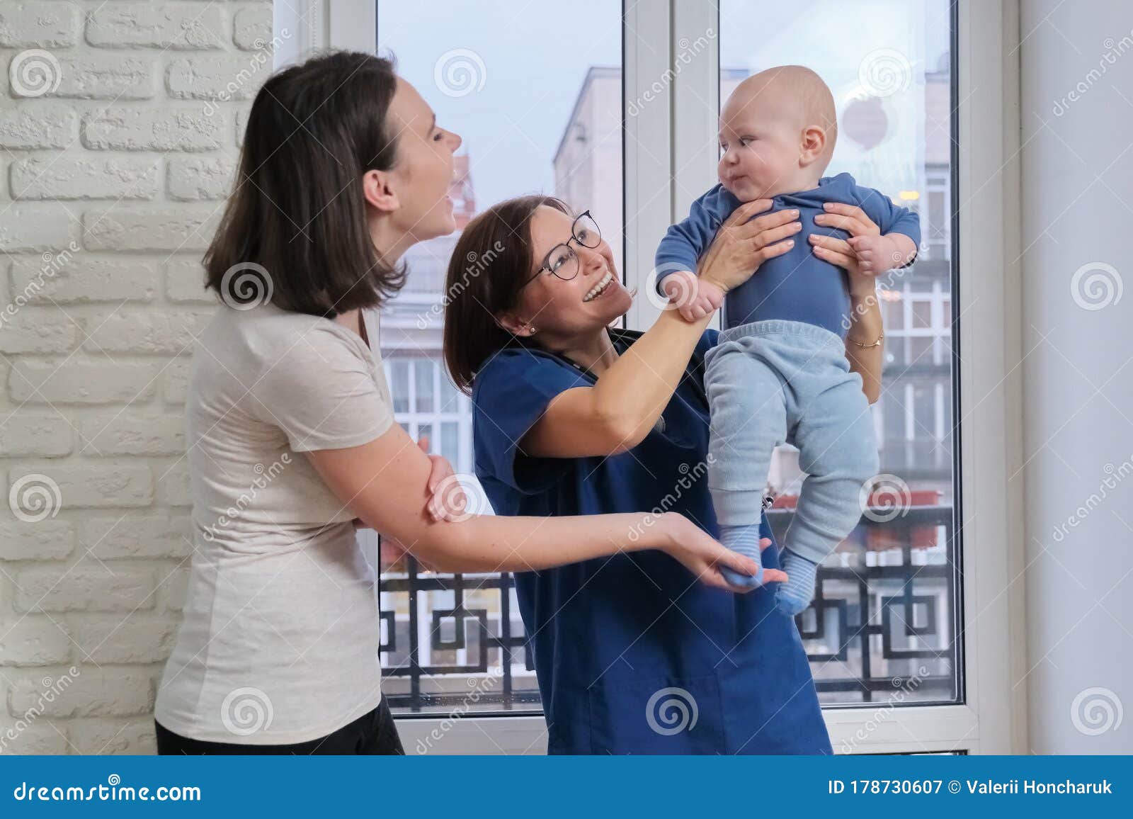 Visit Of Doctor Pediatrician Home Mother With Baby Son Talking With