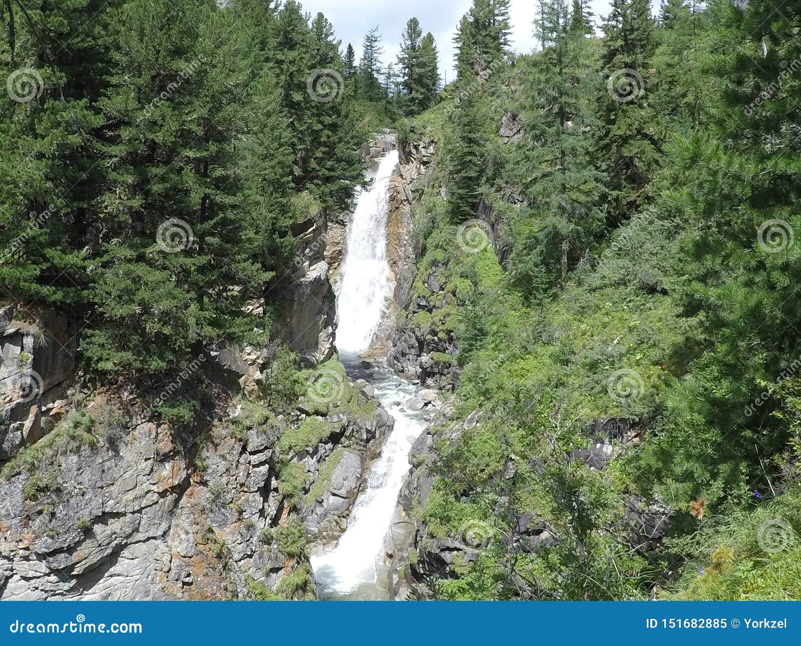 beautiful two-level waterfall on the river chubaty on the way to the eponymous pass in buryatia