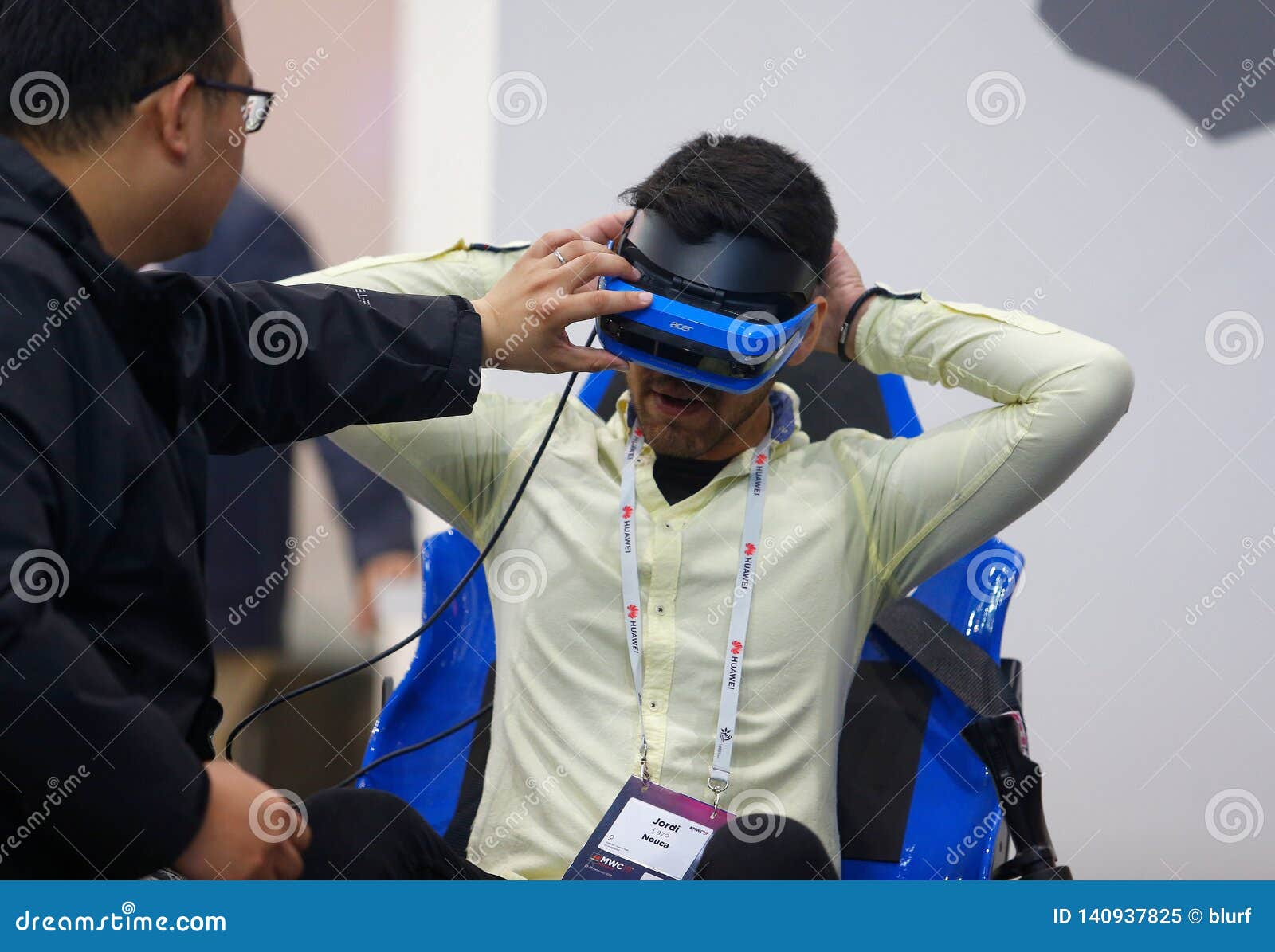 Visitors Testing VR Headset System at Mobile World Congress 2019 in
