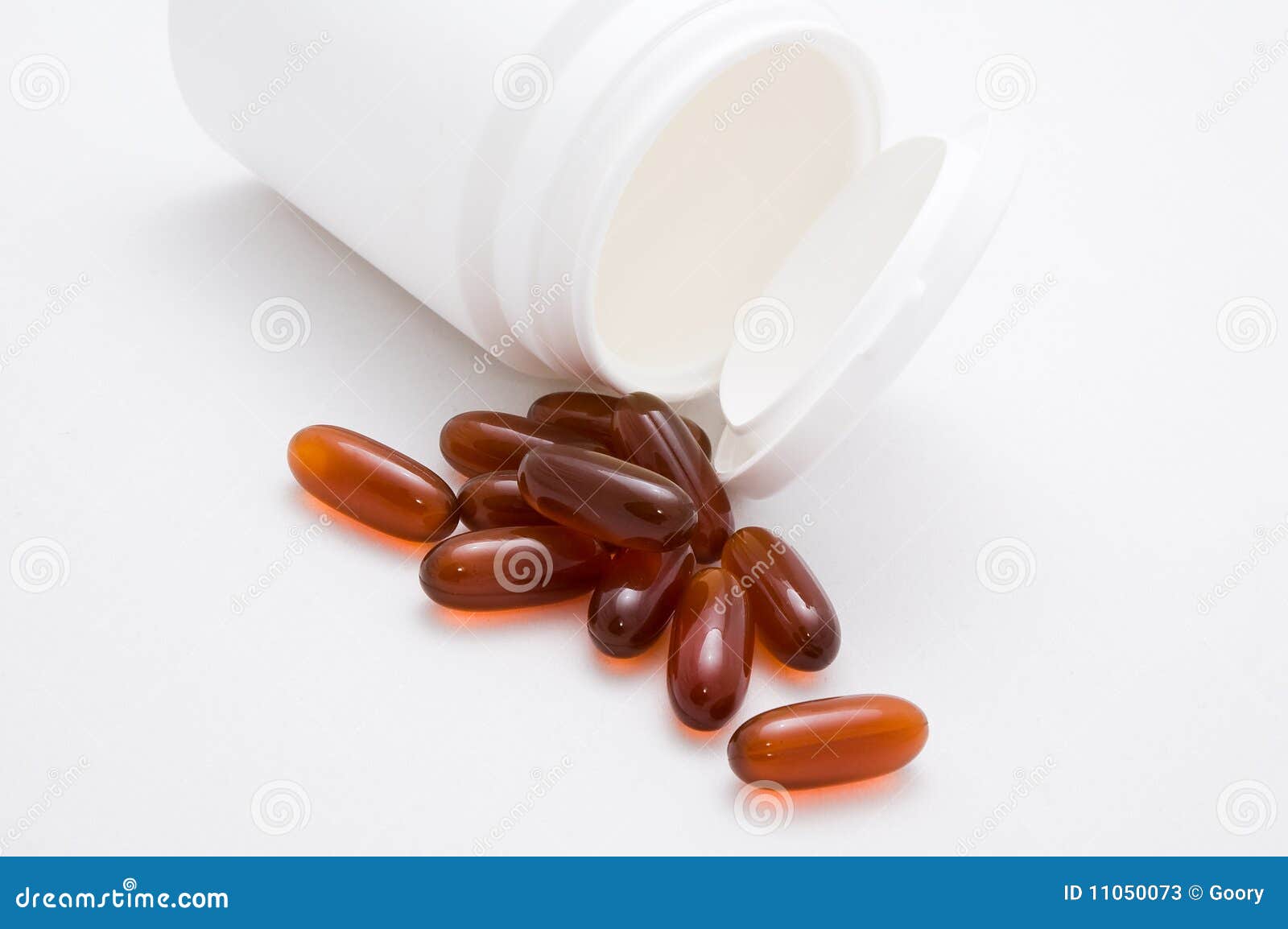 Vitamins and container 3 stock image. Image of pills 11050073