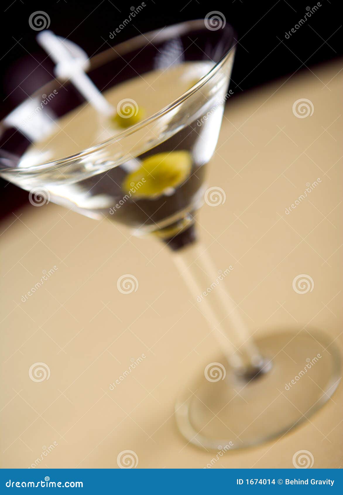 Vodka Martini With Olive Garnish. Long Drink Alcoholic Cocktail On Pink