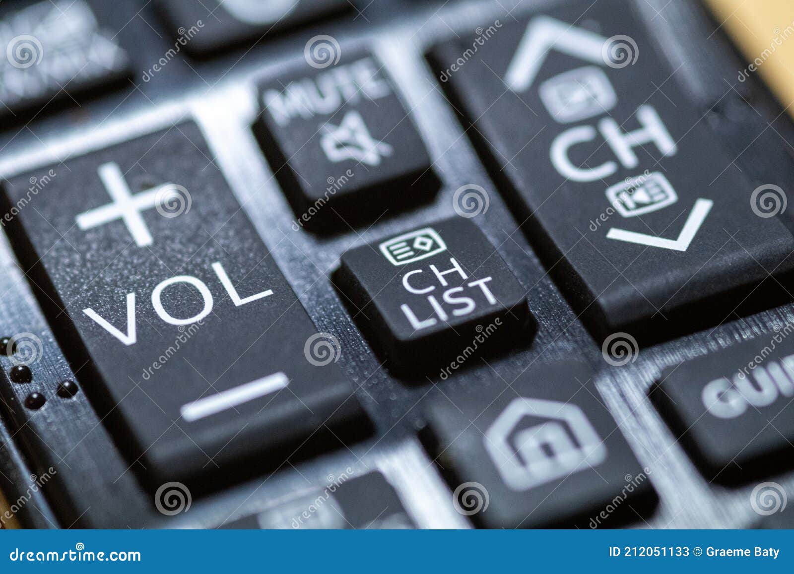 Volume Button Closeup on TV Remote Control with Braille Stock Image