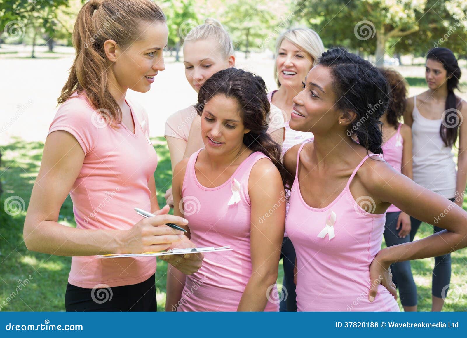 Volunteer Assisting Participants during Breast Cancer Awareness Stock