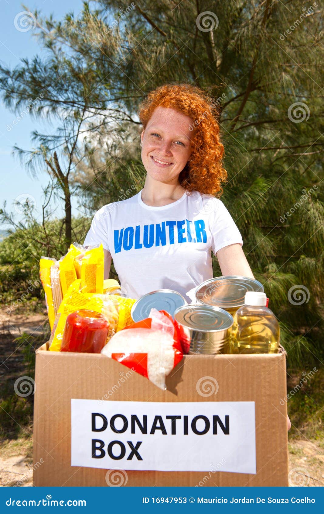 volunteer carrying food donation box