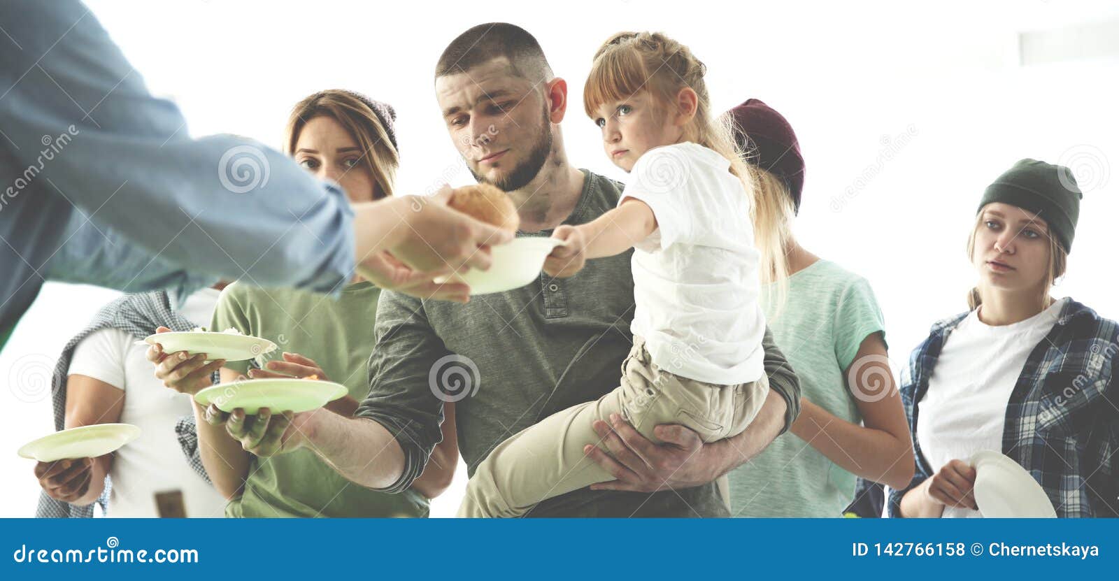 volunteer serving food for poor people