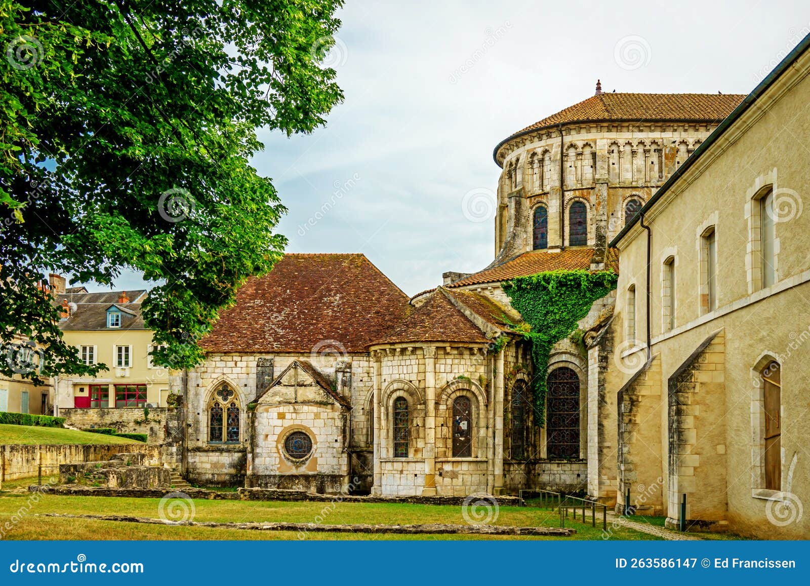 the apse of the church of notre-dame and some monastic buildings in the town of la charitÃÂ© sur loire, france.