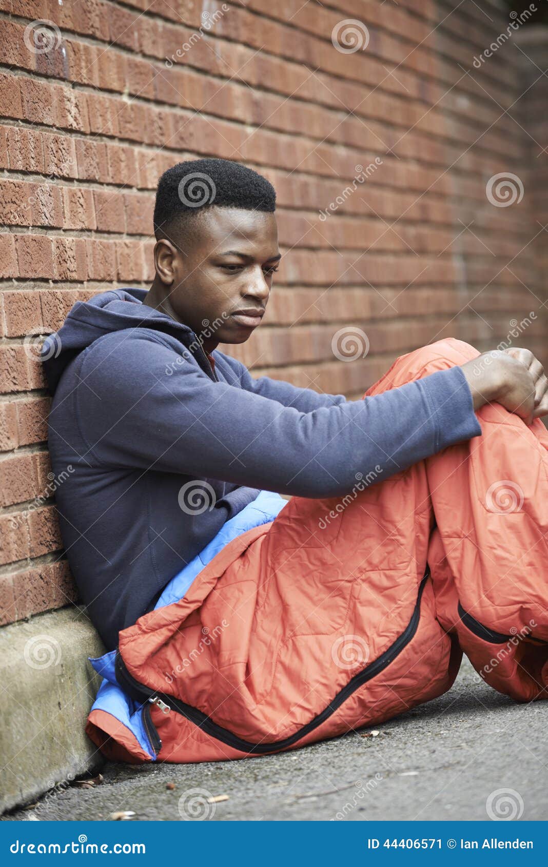 vulnerable teenage boy sleeping on the street