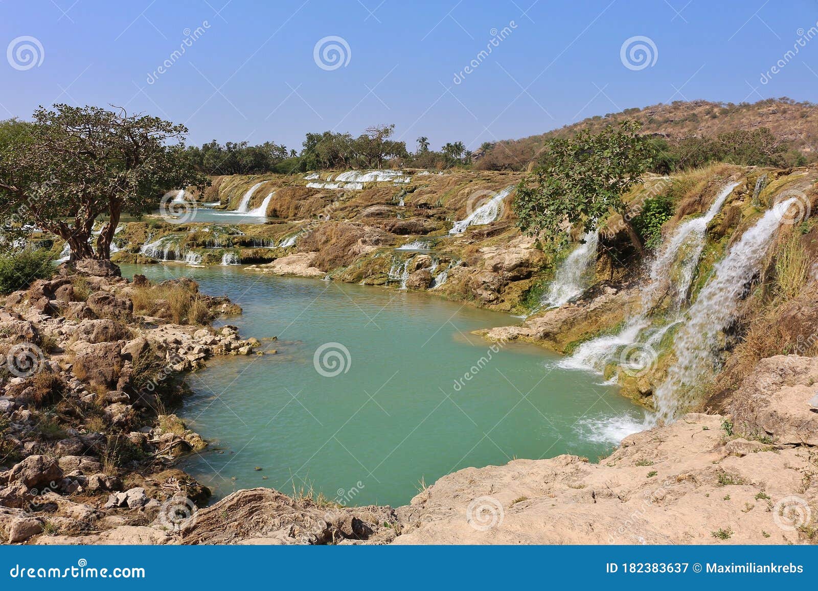 wadi dharbat rock pool with waterfalls