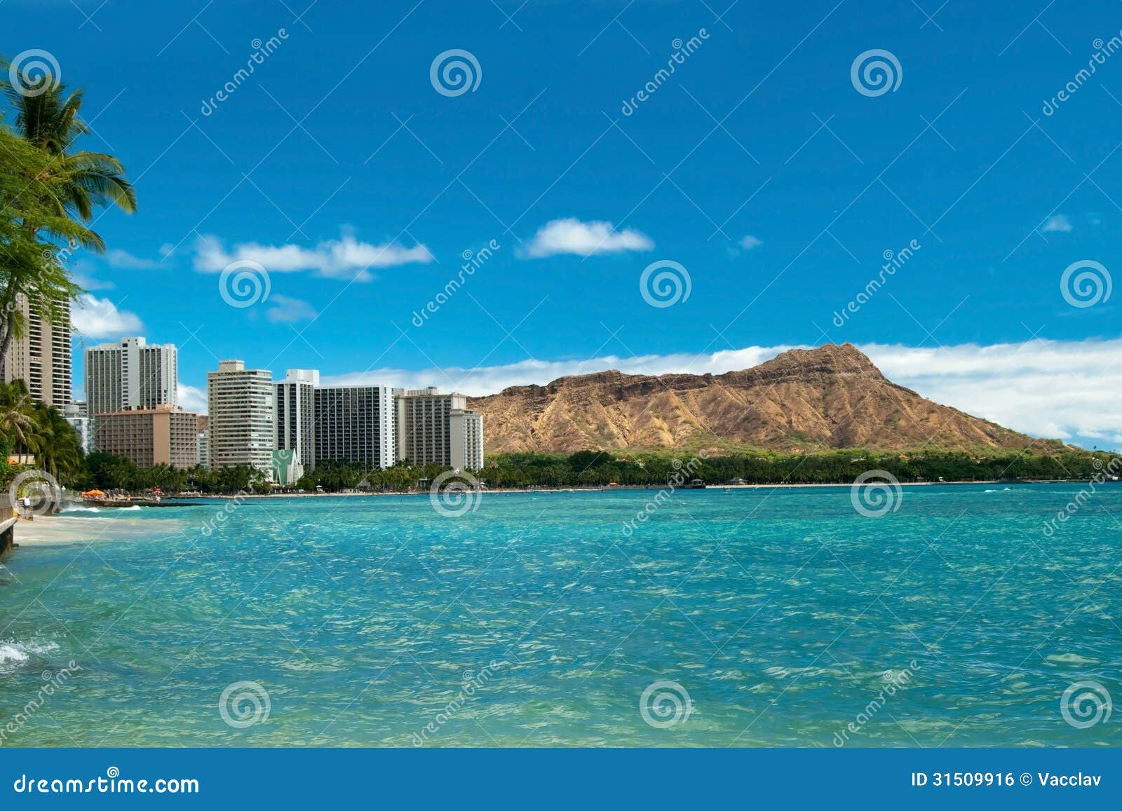 waikiki beach with azure water in hawaii with diamond head