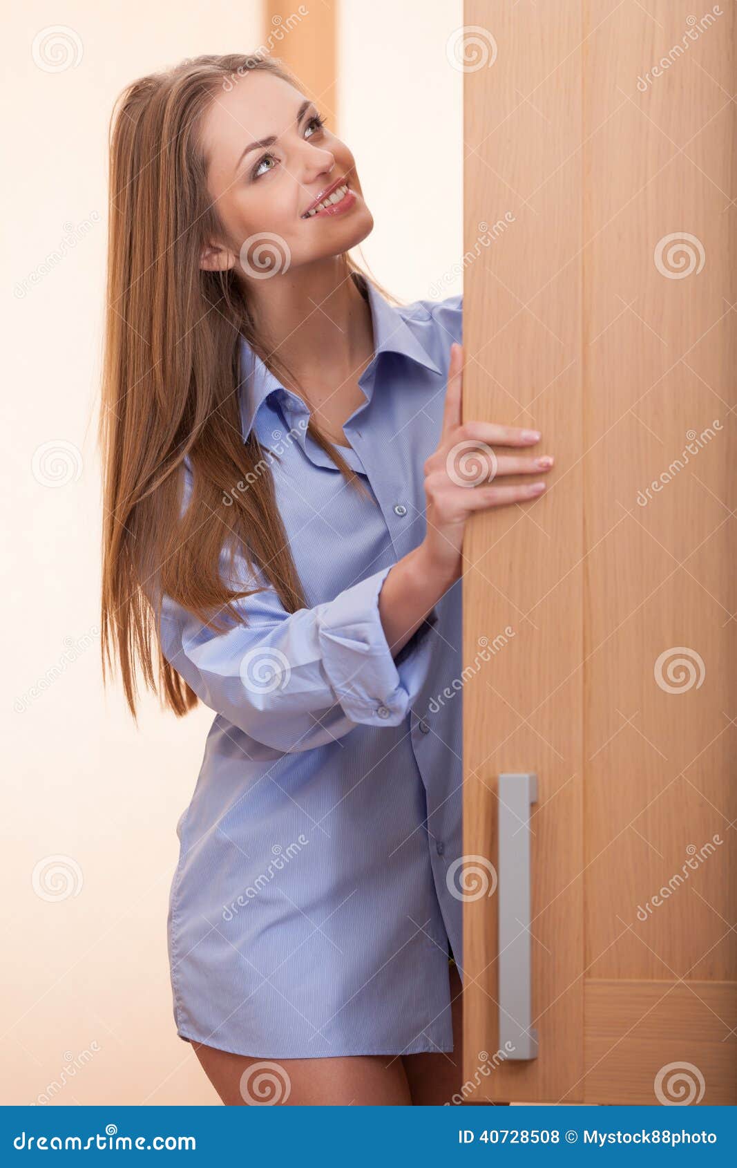Waist Up Of Beautiful Woman Holding Door. Stock Photo - Image of beauty
