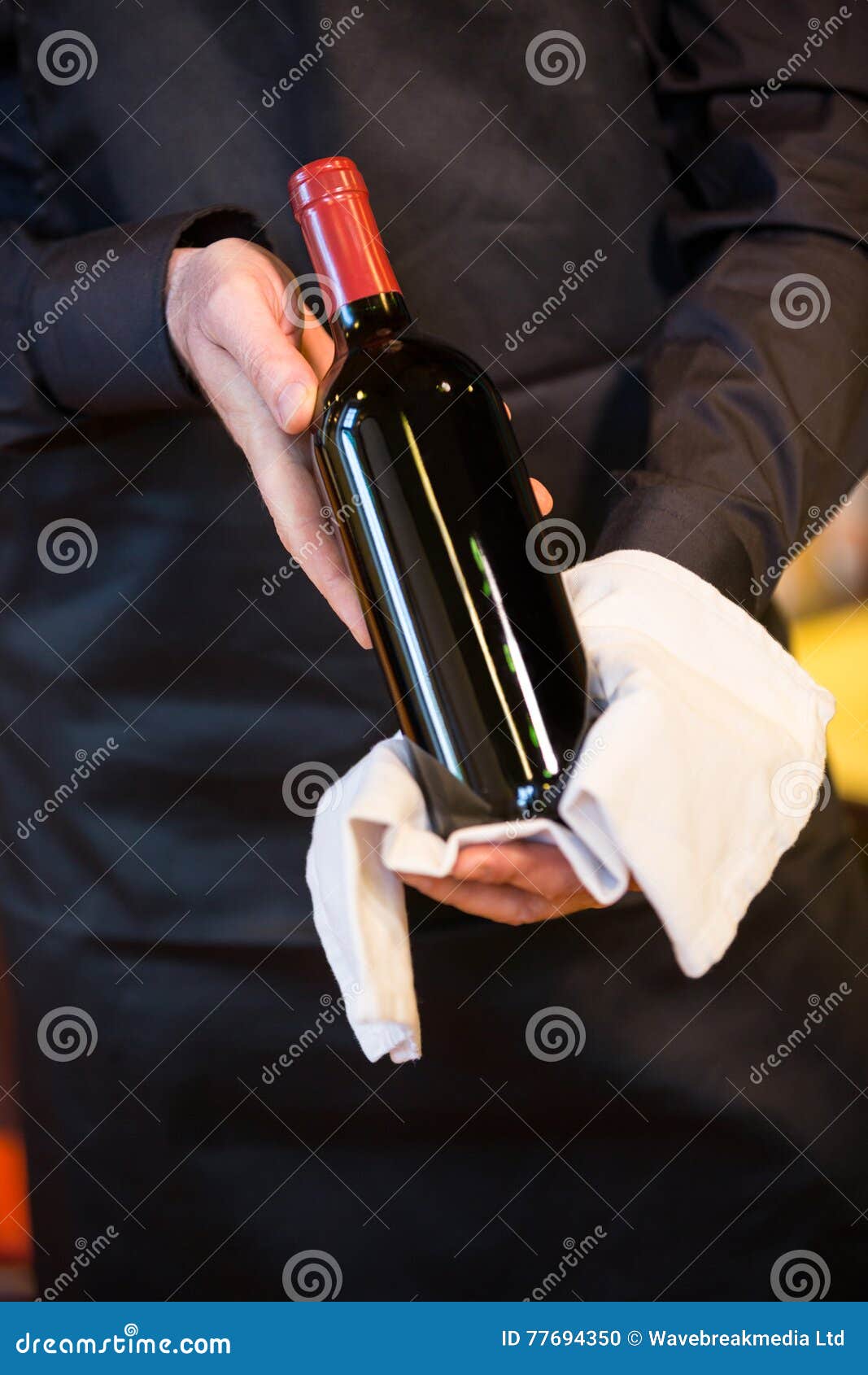 Waiter Holding A Bottle Of Red Wine Stock Photo Image of