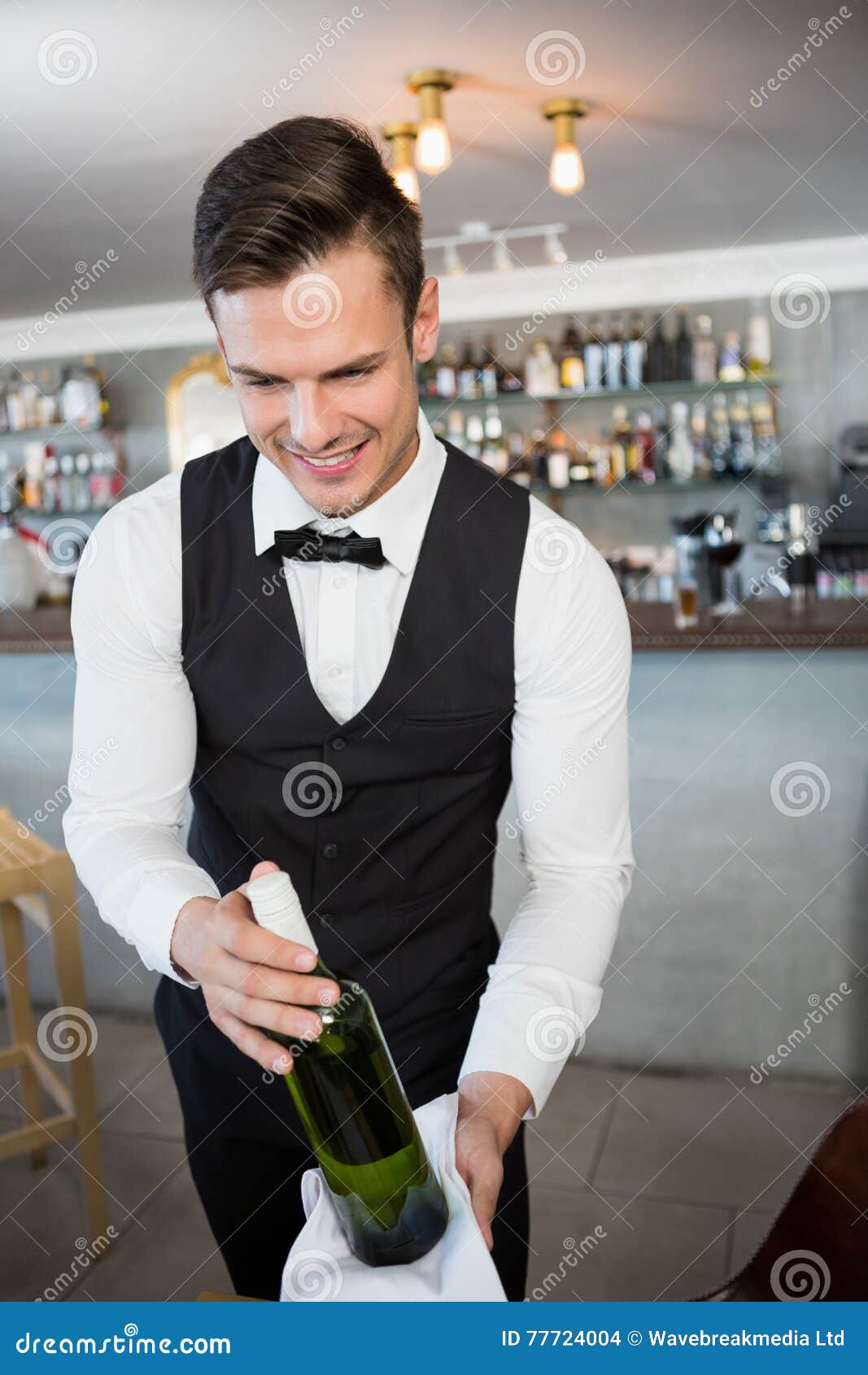 Waiter Holding a Bottle of Wine Stock Photo Image of expertise