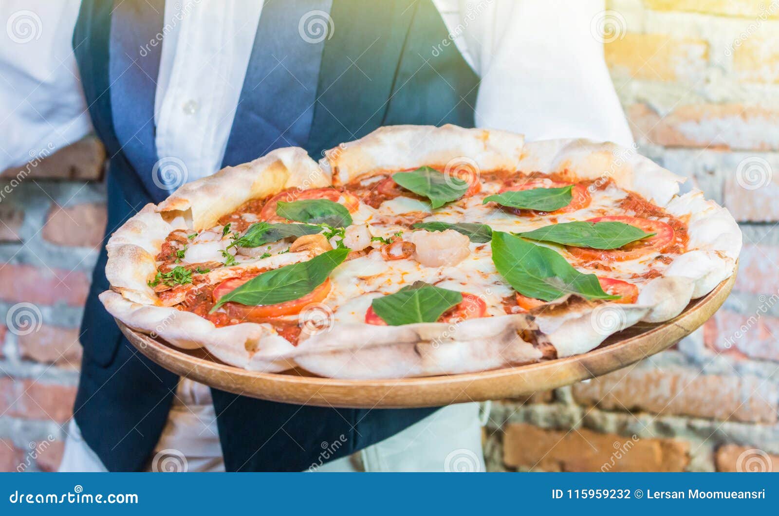 The Waiter Holding the Tray Hot Pizza with Melting Cheese in the Stock ...