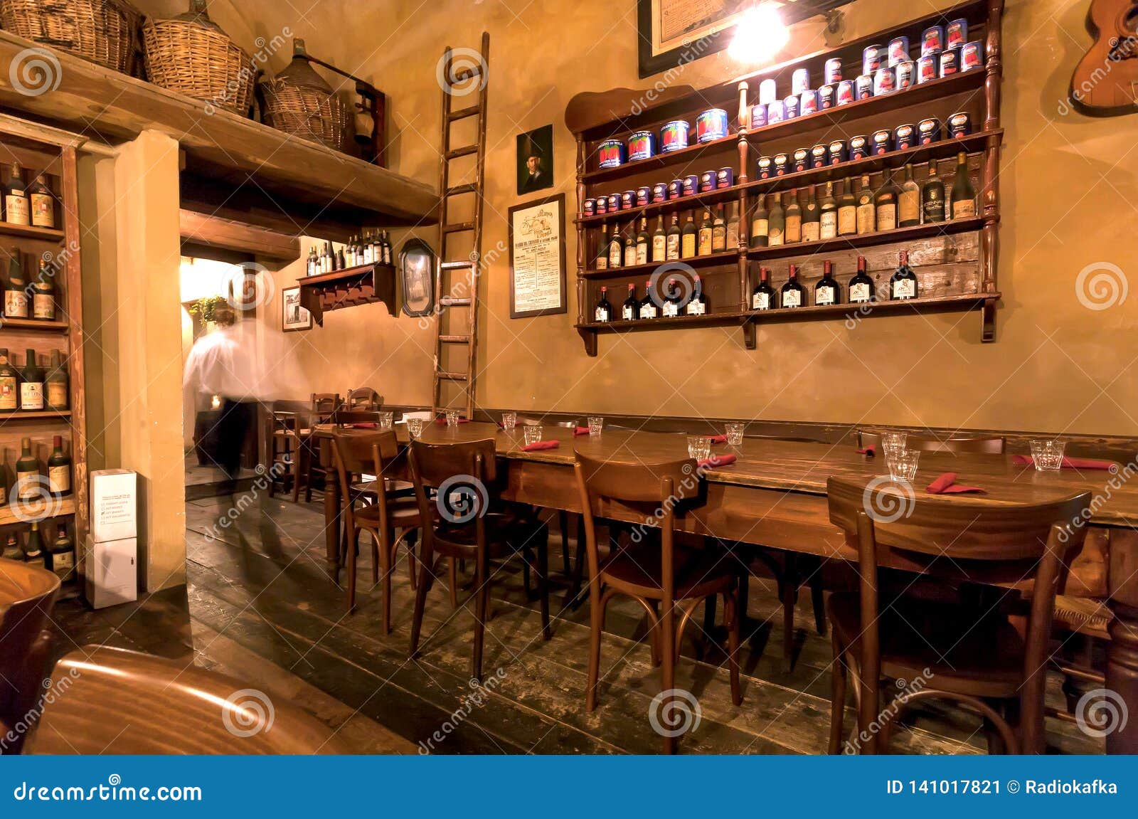 Waiter Moving in Blur Inside Cozy Italian Tavern or Restaurant with