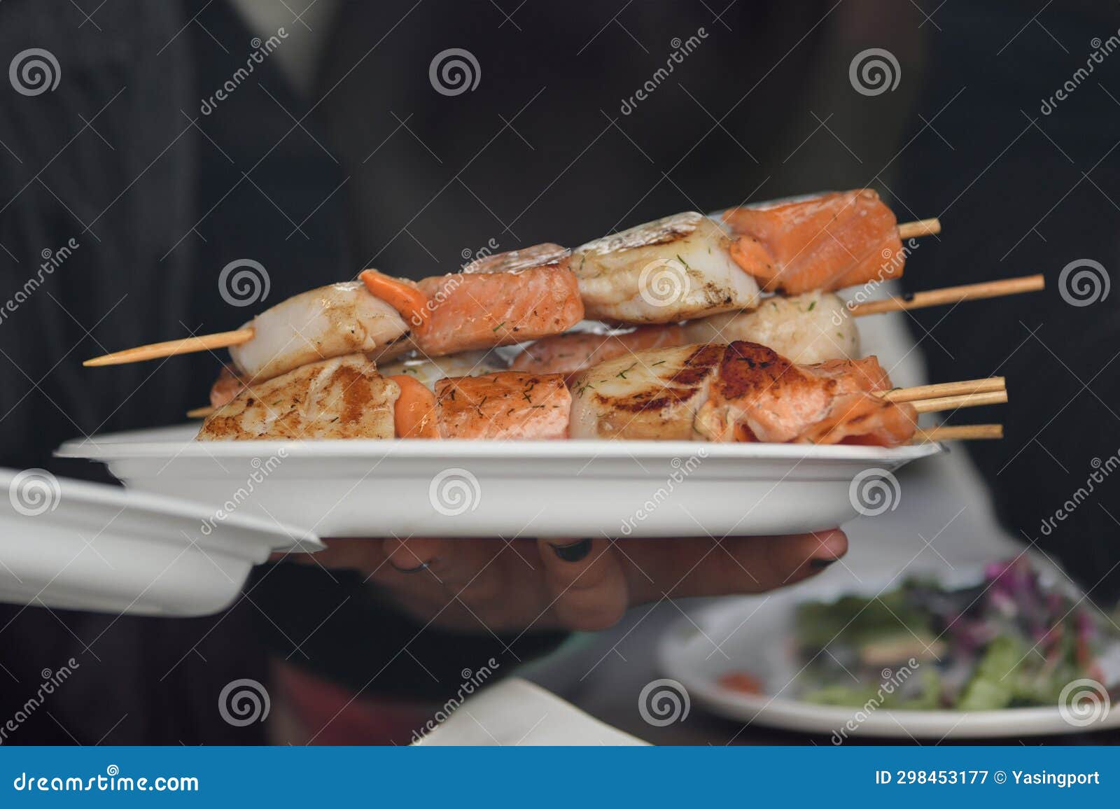 A Waiter Serves Barbecued Scallops in a Plastic Plate at a Fair Stock Image Image of plate