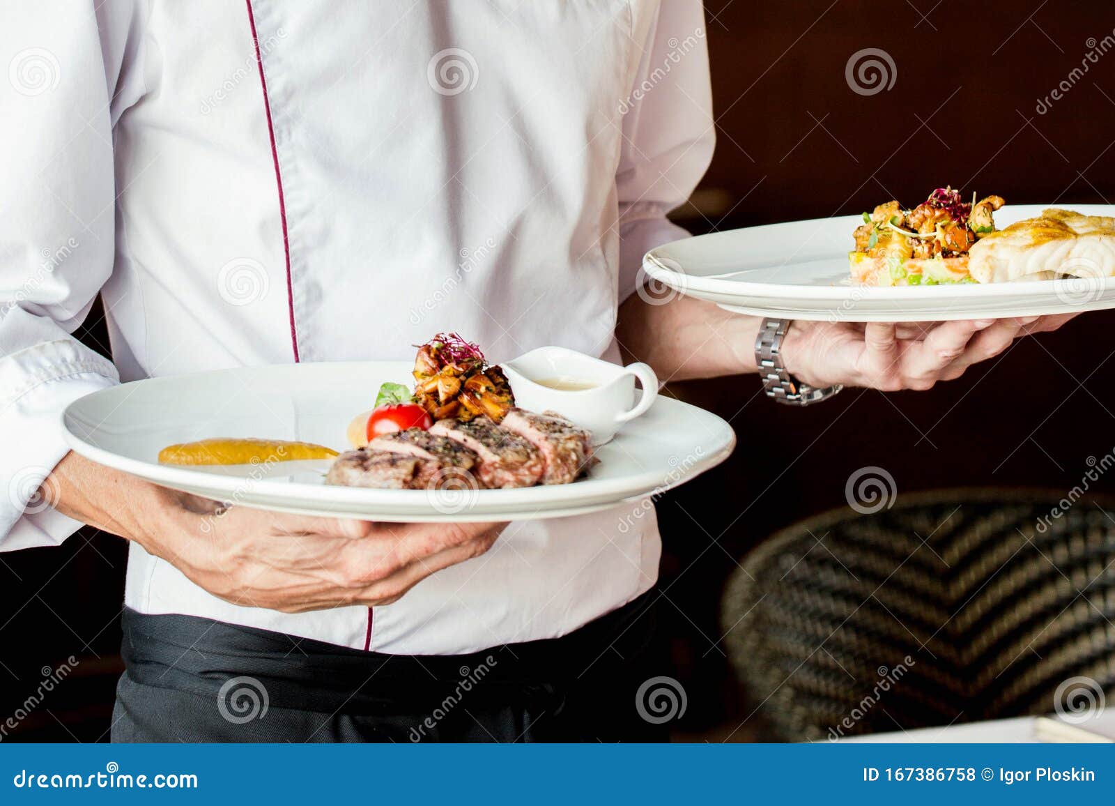 the waiter serves restaurant dishes