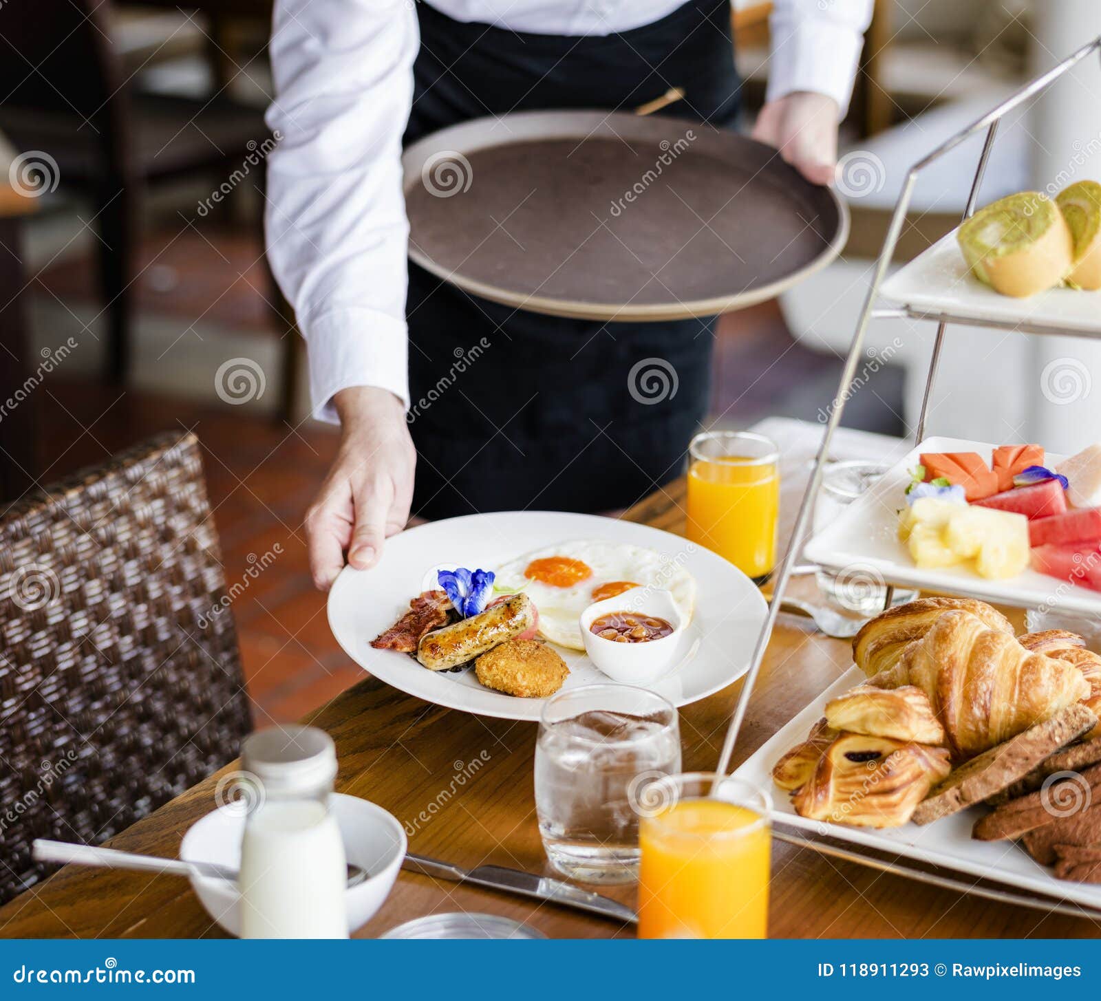 Waitress Serving Breakfast at a Restaurant Stock Image - Image of