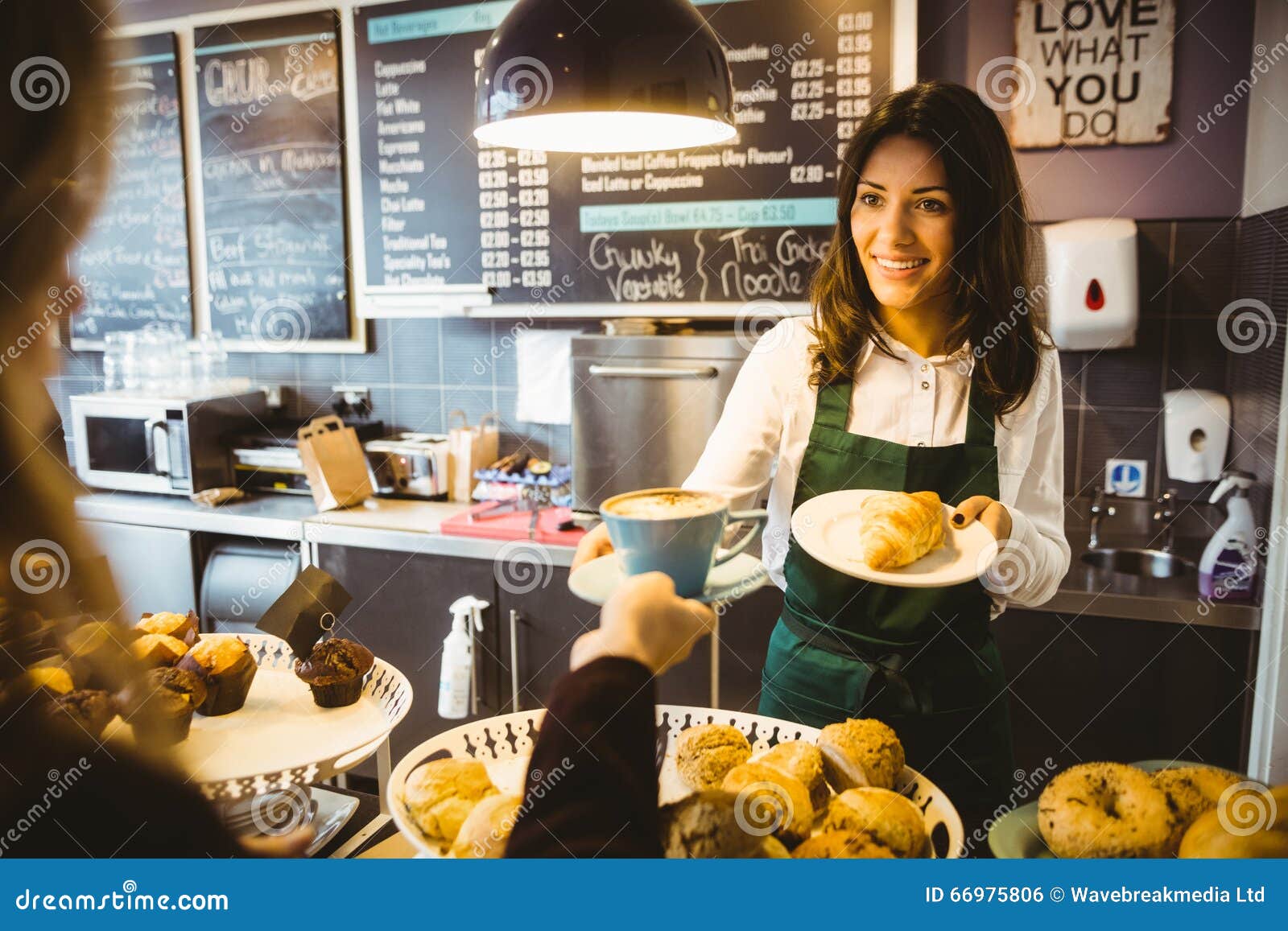 waitress serving a cup of coffee