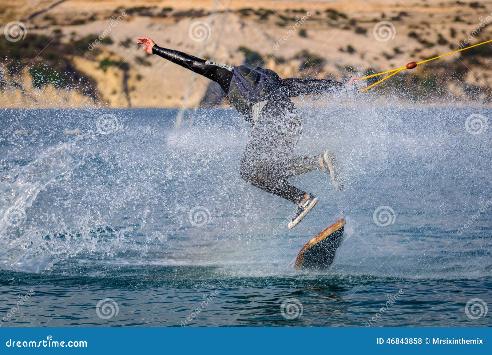 wakeskater in a cable park doing tricks
