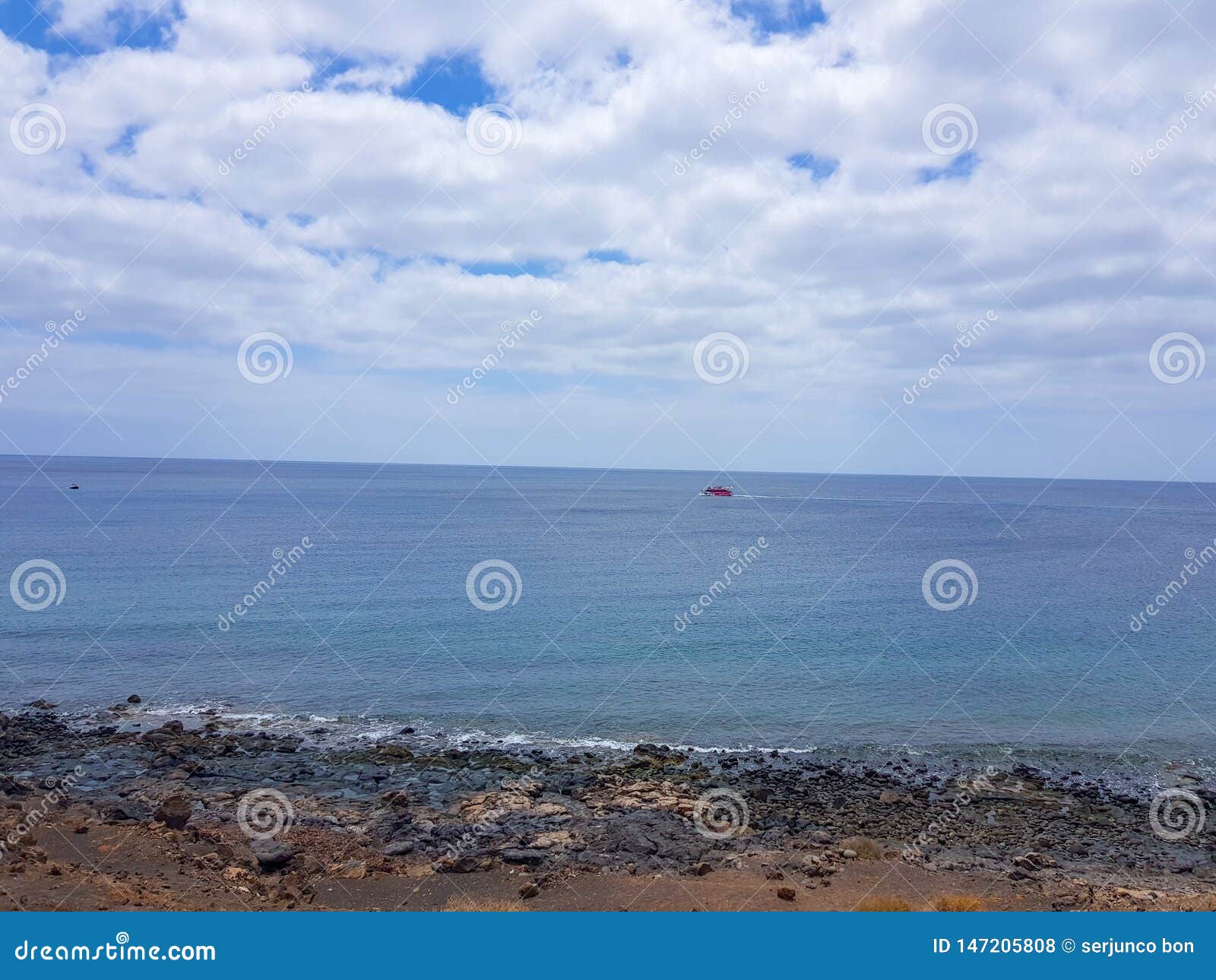 walk along the coast between the coastal towns of puerro del carmen and puerto calero. lanzarote, spain