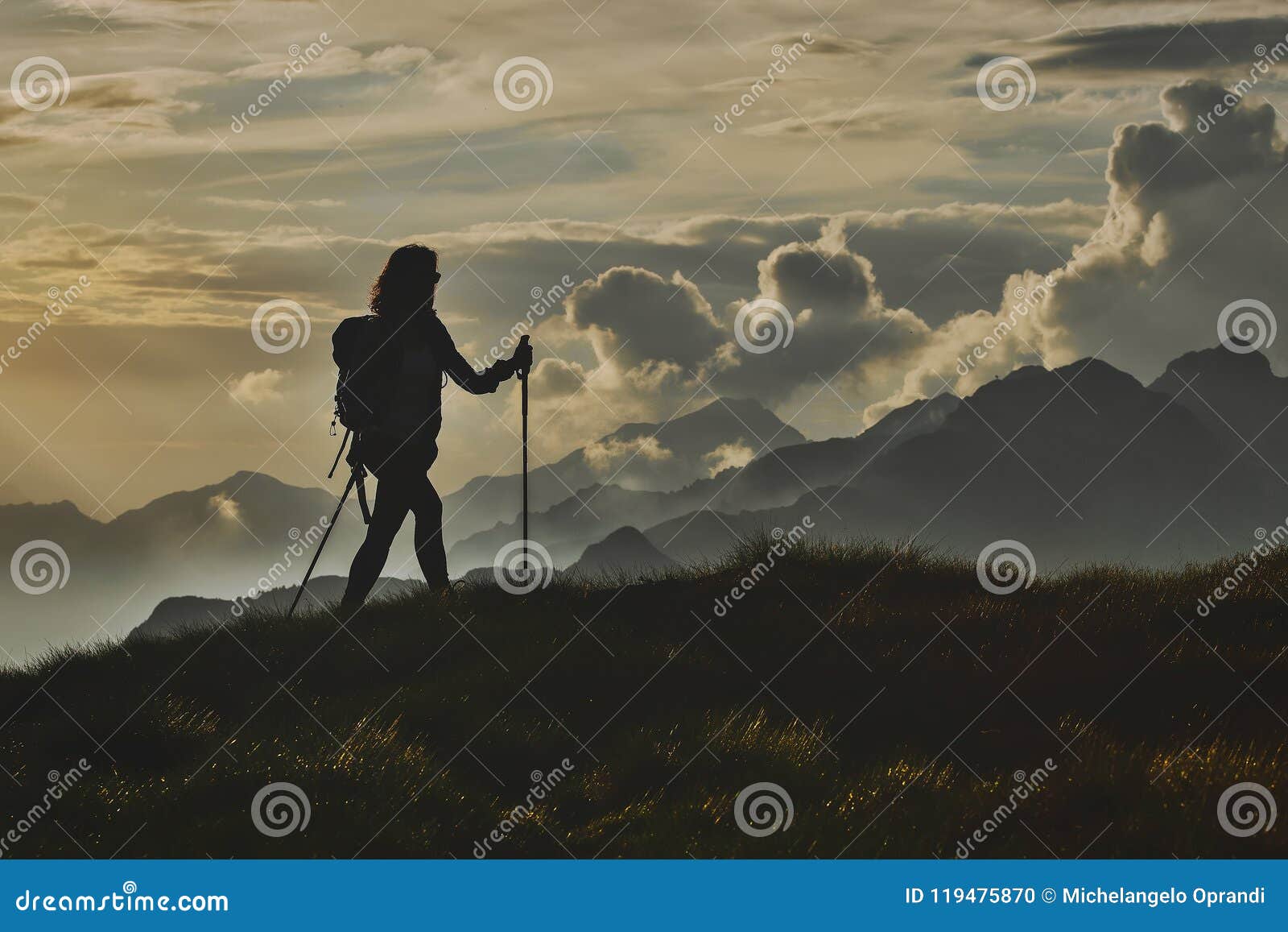 walk in solitude on the alps. a woman on with the background of