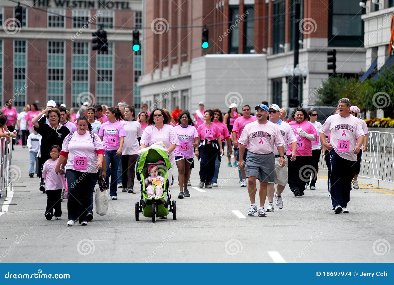 Walkers finish the 5K race. Walkers finish the Gloria Gemma 5K Road Race for Breast Cancer Awareness.