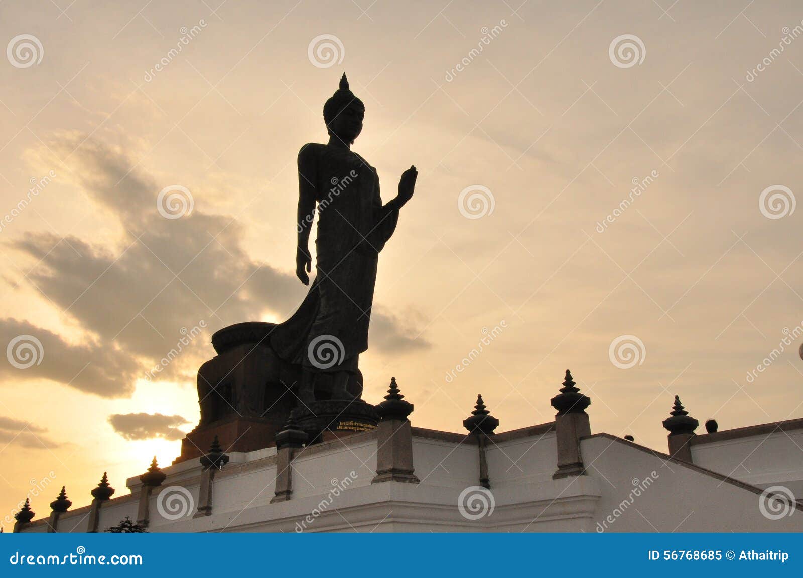walking buddha with silhouete background