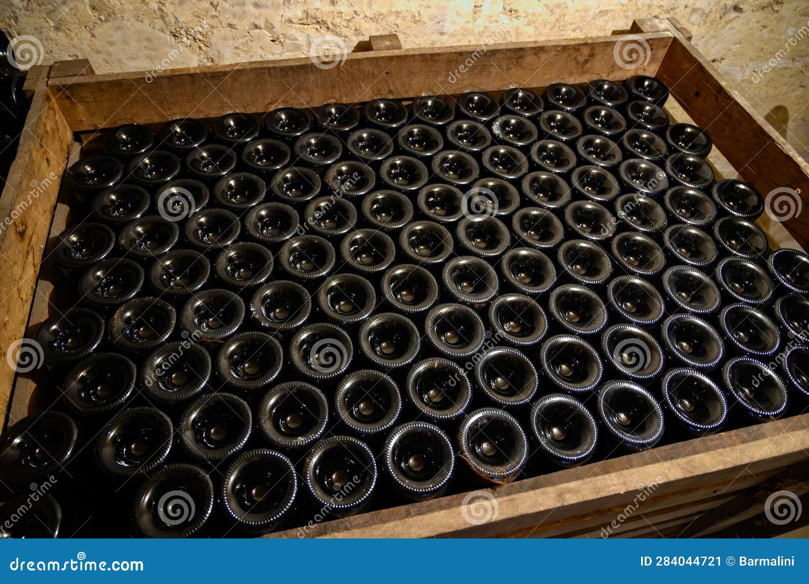 disgorgement and adding sweet liquor procedure, traditional making champagne sparkling wine from chardonnay and pinor noir grapes
